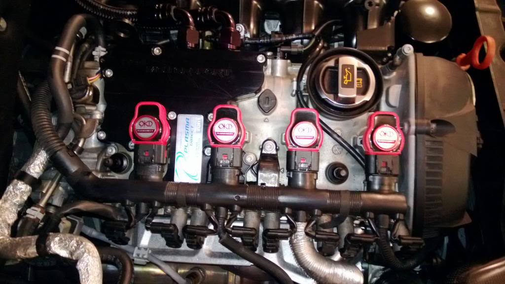 The spark plugs are located under the coil packs