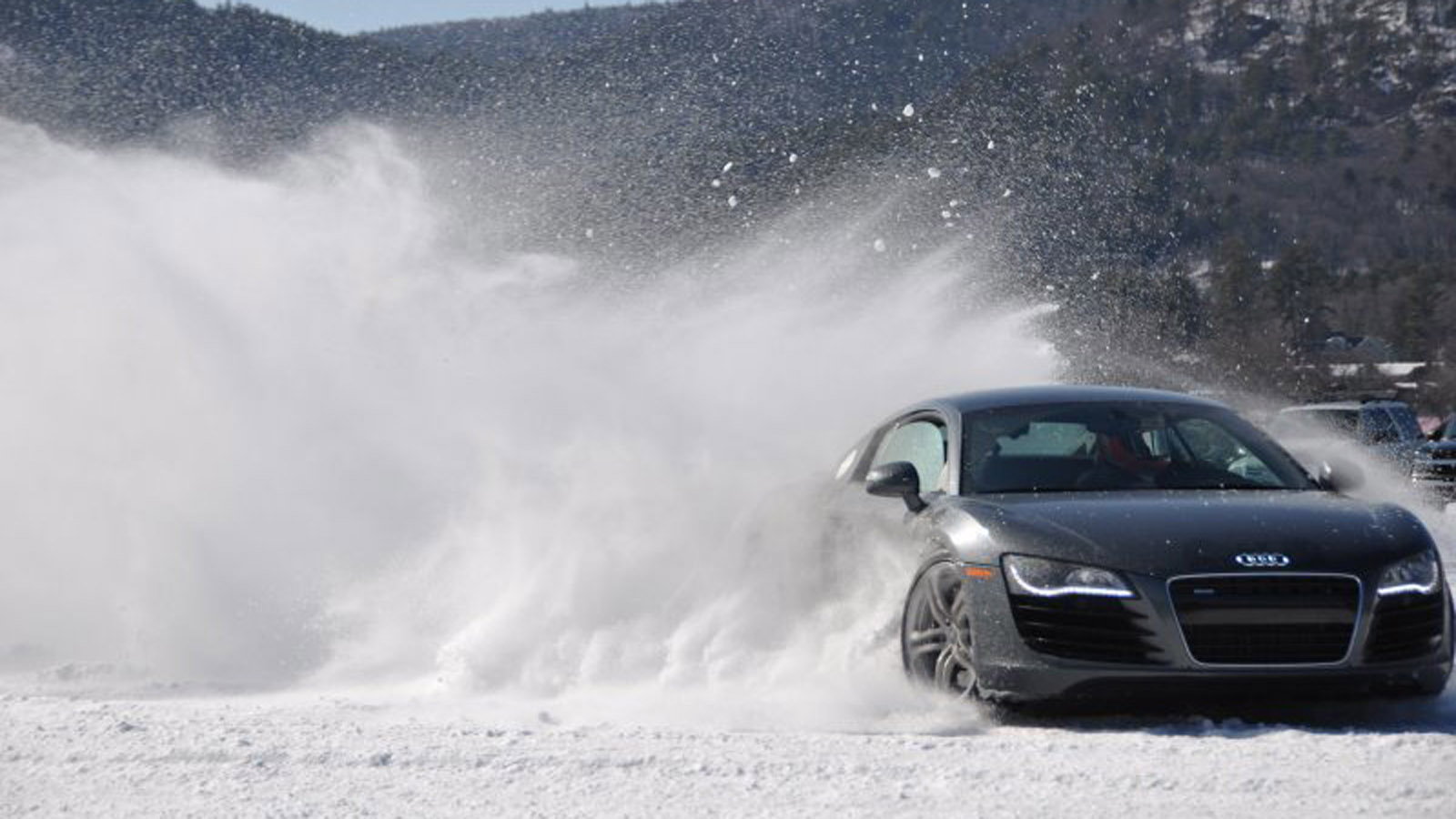 7 Audis Driving Through the Snow