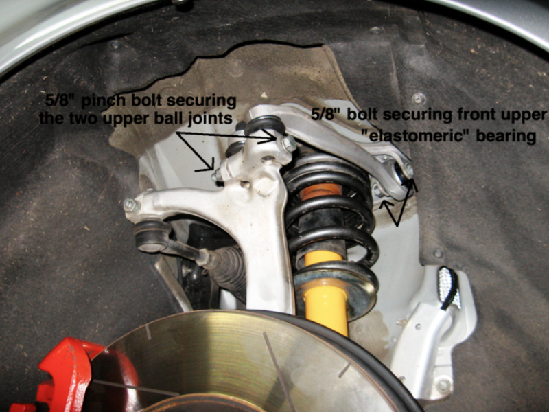 Remove the bolt holding the upper ball joints in place.