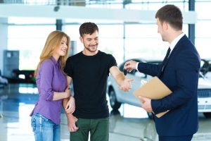 young couple buying a car