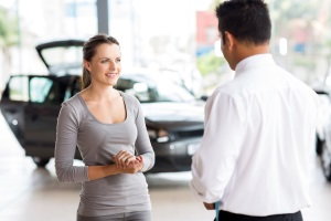 woman talking with car salesman