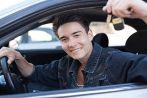 buying a car, holding up car keys