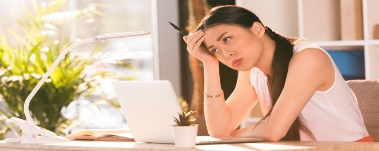 looking frustrated at desk