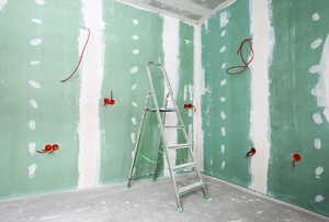 Green board used in the construction of a room.