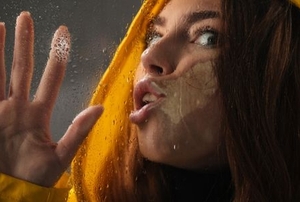 woman stuck to window glass