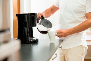 A man pours coffee.