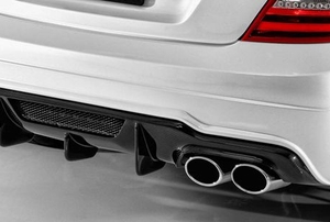 The exhaust pipe on a white vehicle.