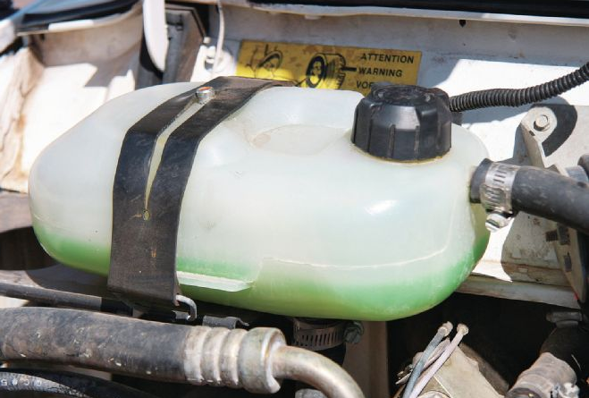 replace radiator overflow tank on jeep cherokee