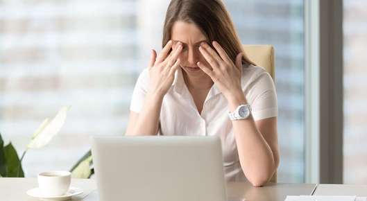 Image of hands using a touch screen tablet.