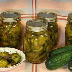 jars of pickles, cucumbers and bowl of pickles