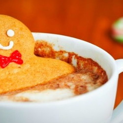 Gingerbread man in cup of cocoa