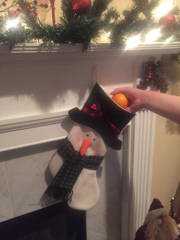 stocking on mantle with orange