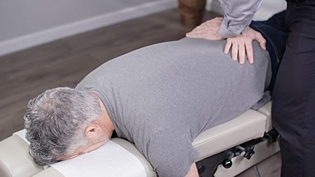 Chiropractic back adjustment.