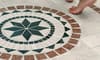 Bare feet on a mosaic tile floor.