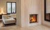A room with a glass fireplace cover.