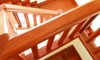 shiny clean wooden banister railing on wooden stairway from above