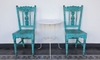 A set of blue shabby chic chairs. 