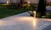 lit and landscaped stone driveway