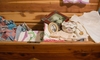A cedar chest filled to the brim with old family heirlooms.