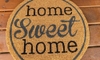 home sweet home welcome mat on wood porch
