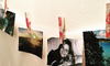 A garland of photos held on a string with decorated clothespins. 