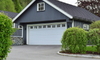 large garage with white door and molding