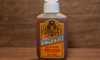 bottle of Gorilla Glue in front of wood surface