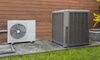 Heat pump unit on the side of a building