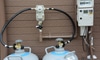 two propane tanks with a connective hose
