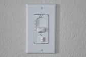 wall mounted switch with fan and light controls