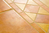 yellow and terra cotta colored floor tiles