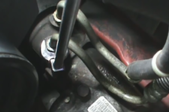 Power steering hose in an engine