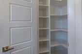 White corner pantry with shelves