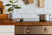 induction stove in clean, modern kitchen