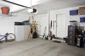 Garage with some items lined up along the walls
