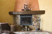 corner fireplace with river rock surround