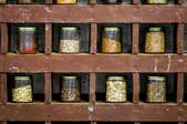 spices in small jars in wooden rock