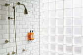 shower with tile back and leaded glass wall