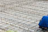 man working on rebar for a foundation