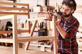man building a wooden chair