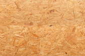 A close look at the texture of oriented strand board.