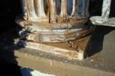 A column and porch with cracks that all need to be filled and painted.