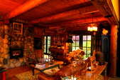 Interior view of a lavishly furnished log home.