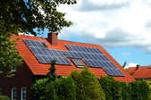 solar panels mounted to a tile roof