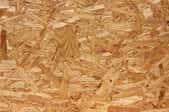 A close-up image of oriented strand board.