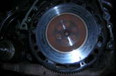 A close-up of the car flywheel in a Honda Civic.