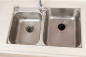 clean, metal sink with garbage disposal