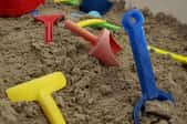 plastic children's toys in sand