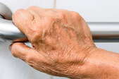 hand holding support grab bar
