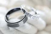 polished wedding rings on white rope